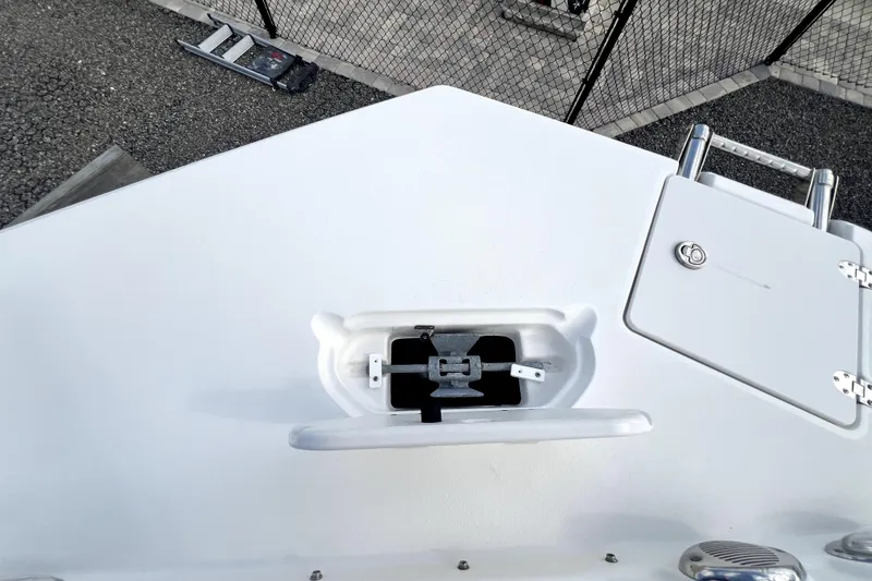 Slide: The Image of 2022 NauticStar 223DC Sport Deck boat anchor compartment and hatch detail. - 89