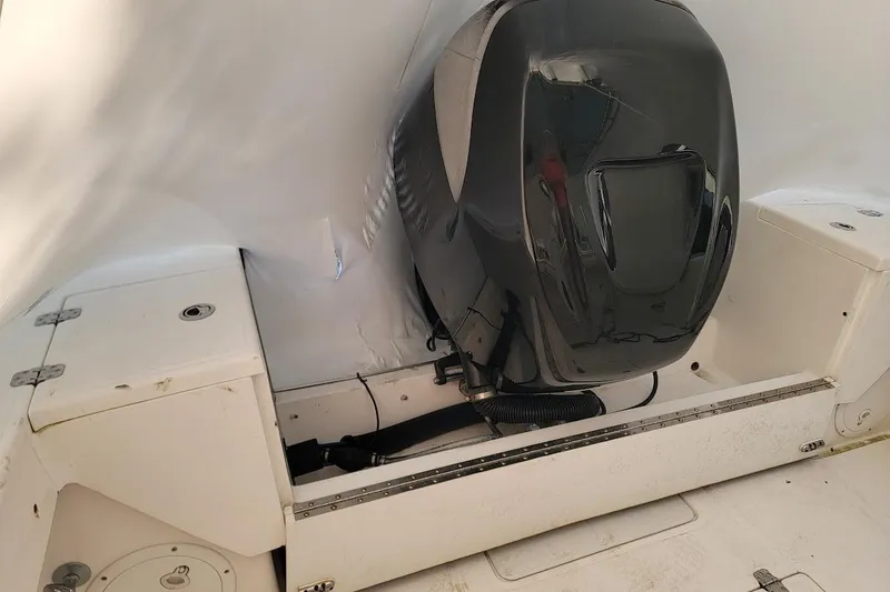 Slide: The Image of 2003 SeaCraft SC 23 Classic boat engine compartment with outboard motor. - 11