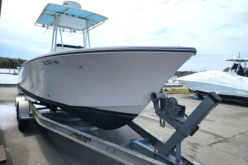 Slide: The Image of 2003 SeaCraft SC 23 Classic boat on trailer, dockside view. - 18