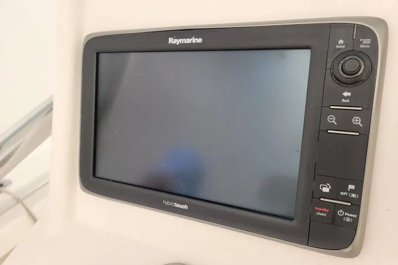 Slide: The Image of Raymarine display on 2003 SeaCraft SC 23 Classic boat dashboard. - 2