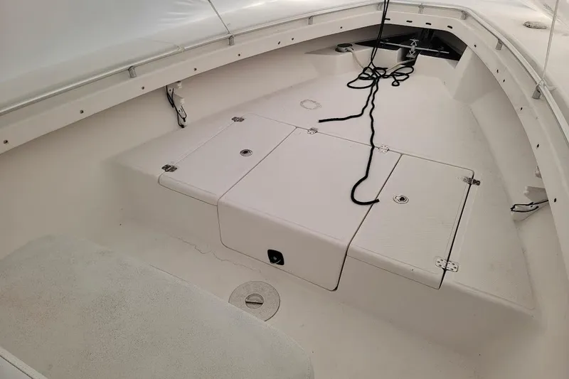 Slide: The Image of 2003 SeaCraft SC 23 Classic boat interior with storage compartments and rope. - 5