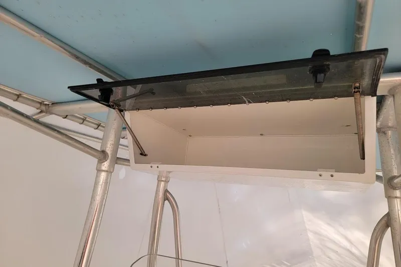 Slide: The Image of Open storage compartment on a 2003 SeaCraft SC 23 Classic boat. - 9