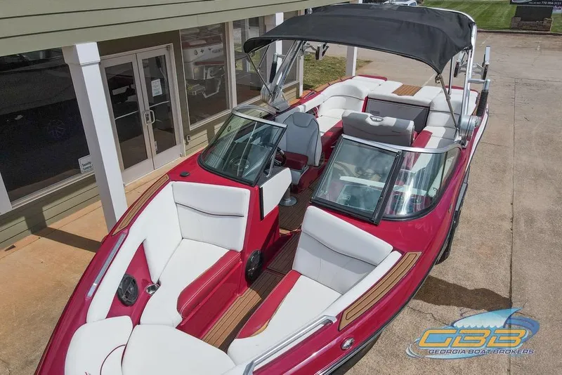 Slide: The Image of 2018 MasterCraft XT25 boat with red and white interior, displayed at Georgia Boat Brokers. - 23