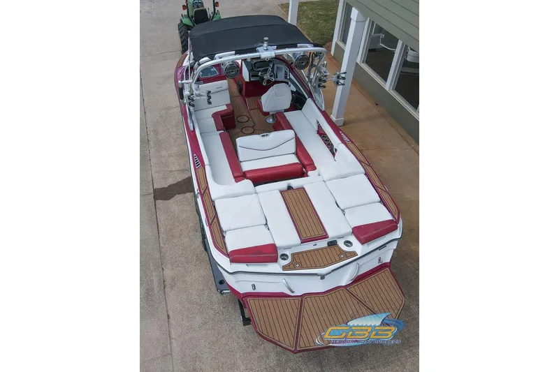 Slide: The Image of 2018 MasterCraft XT25 boat with red and white interior, viewed from above. - 26