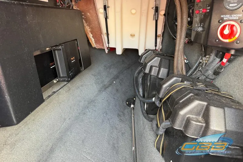 Slide: The Image of Interior view of a 2018 MasterCraft XT25 boat showing battery compartments and wiring. - 33