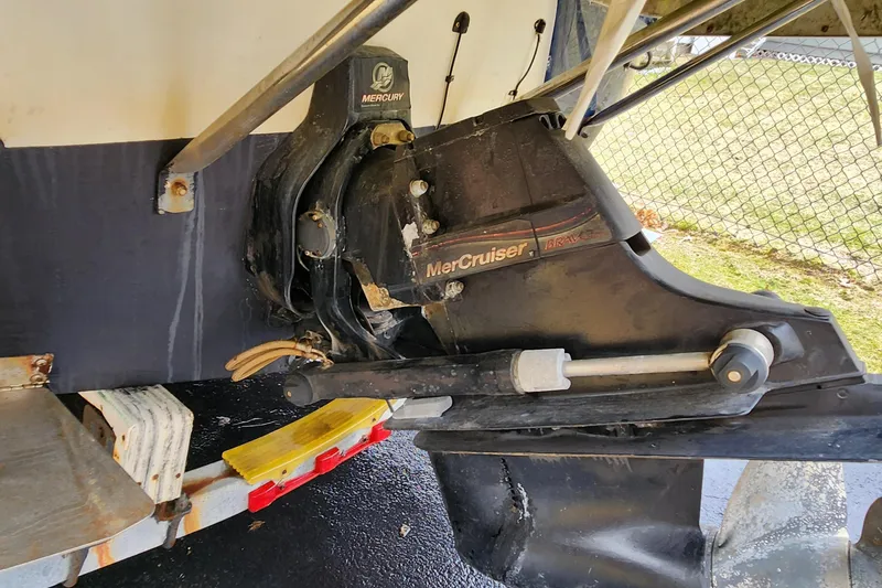 Slide: The Image of 2006 Crownline 236 SC boat with MerCruiser Bravo outdrive on trailer. - 12