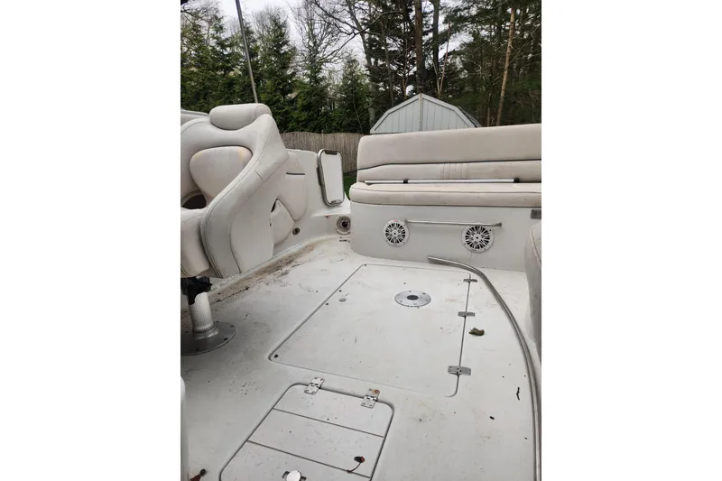 Slide: The Image of 2006 Crownline 236 SC boat interior with white seating and speakers. - 3