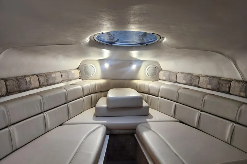 Slide: The Image of Interior cabin of 2006 Crownline 236 SC boat with plush seating and ambient lighting. - 5