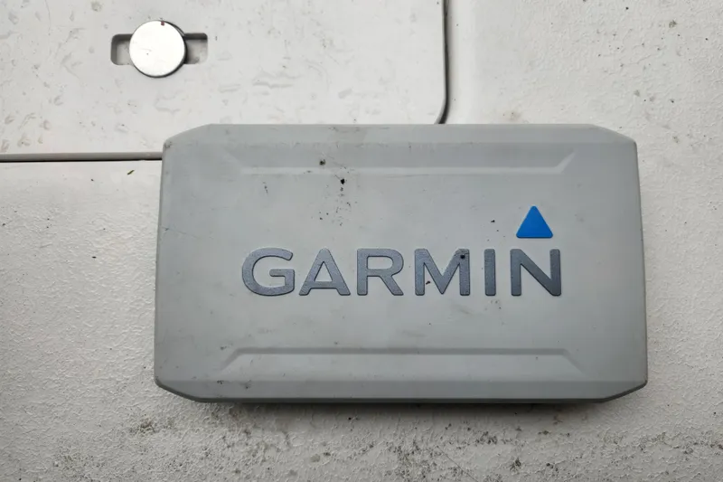 Slide: The Image of Garmin device on 2006 Crownline 236 SC boat, featuring a gray casing with logo. - 9