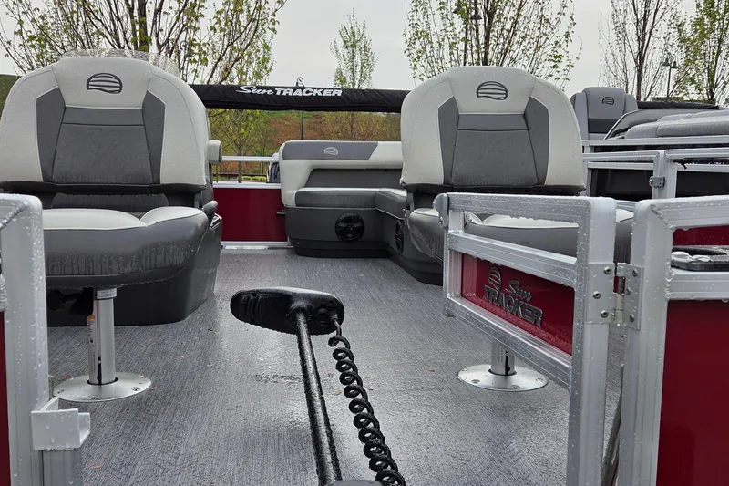 Slide: The Image of 2026 Sun Tracker Bass Buggy 16 XL Select pontoon boat interior with seating and wet deck. - 2