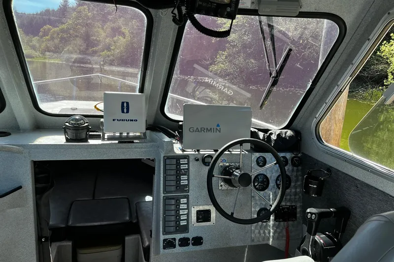 Slide: The Image of Interior of a 1998 Maxweld Cuddy Hardtop boat with Garmin and Furuno navigation systems. - 6