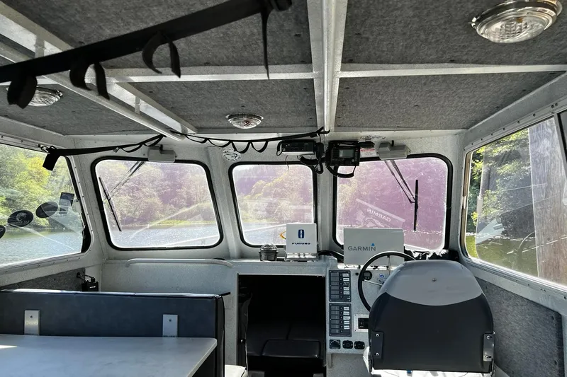 Slide: The Image of Interior of a 1998 Maxweld Cuddy Hardtop boat with navigation equipment. - 7