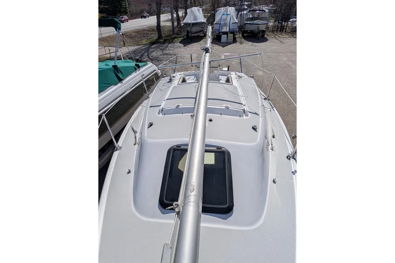 Slide: The Image of 2007 Catalina 22 Mark II sailboat deck view with mast and hatch. - 3