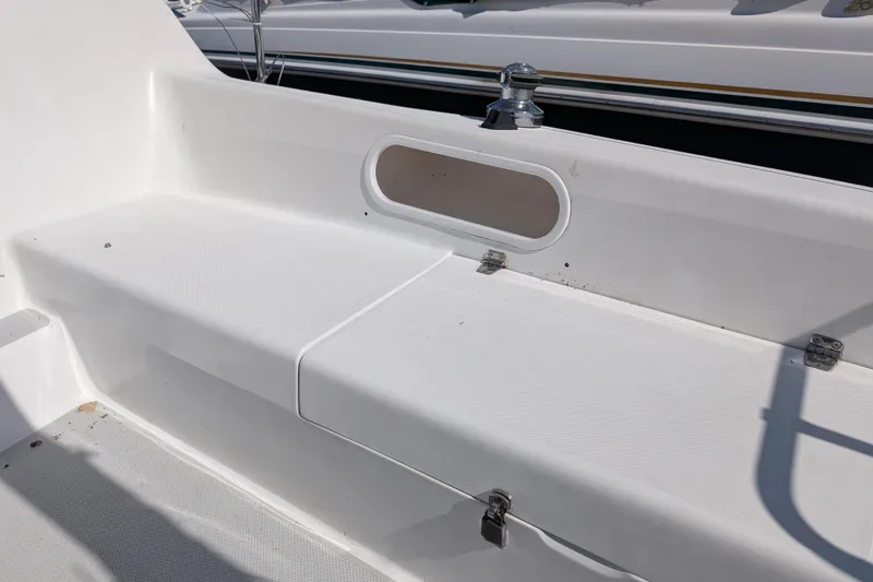 Slide: The Image of White seating area on a 2007 Catalina 22 Mark II sailboat deck. - 7