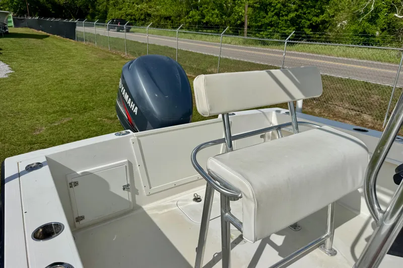 Slide: The Image of 2010 Contender 21 Open boat with Yamaha outboard motor and white seating. - 7
