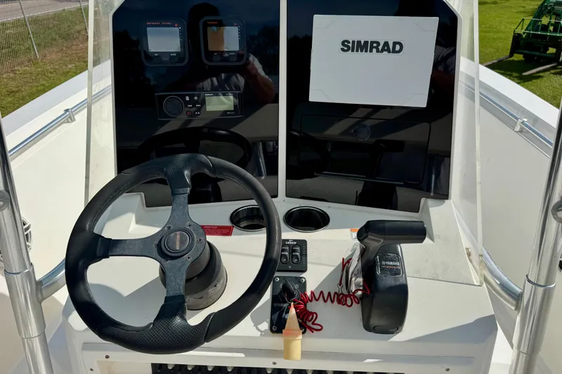 Slide: The Image of Steering console of a 2010 Contender 21 Open boat with Simrad electronics. - 8