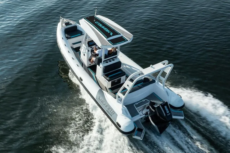 Slide: The Image of Manufacturer Provided Image: 2025 Highfield Escape 750 boat cruising on open water, showcasing sleek design and powerful engine. - 4
