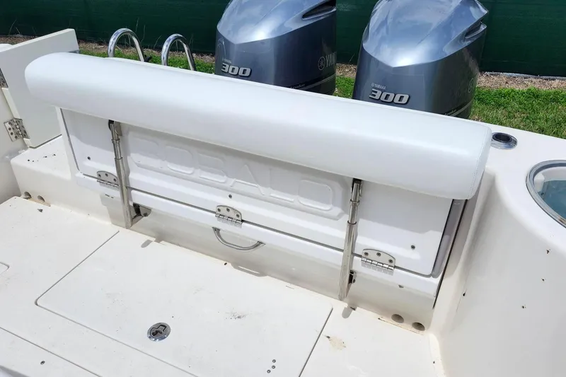 Slide: The Image of 2015 Robalo R300 Center Console boat with dual Yamaha 300 engines, rear seating view. - 11