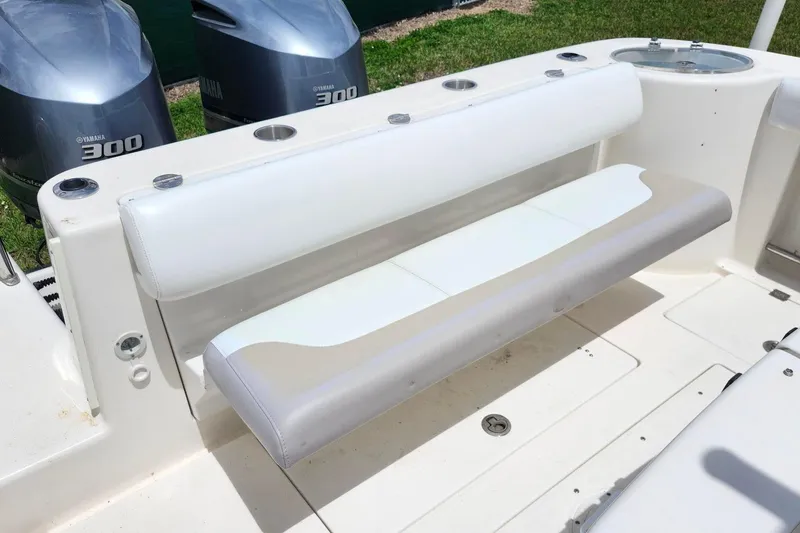 Slide: The Image of 2015 Robalo R300 Center Console boat with Yamaha 300 engines and cushioned seating. - 12