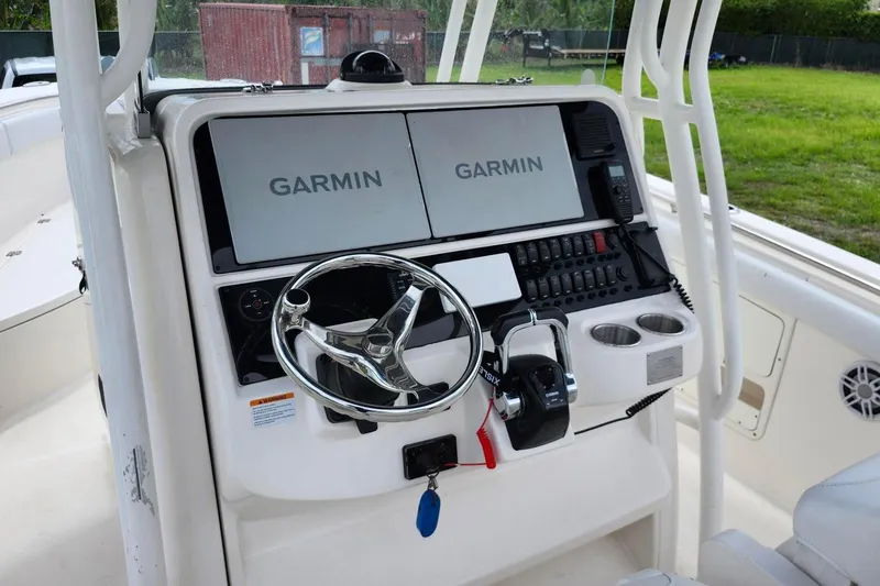 Slide: The Image of 2015 Robalo R300 Center Console boat dashboard with Garmin navigation system. - 18