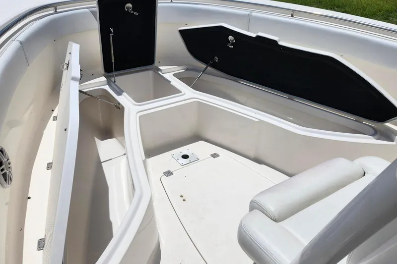 Slide: The Image of 2015 Robalo R300 Center Console boat interior with open storage compartments. - 23