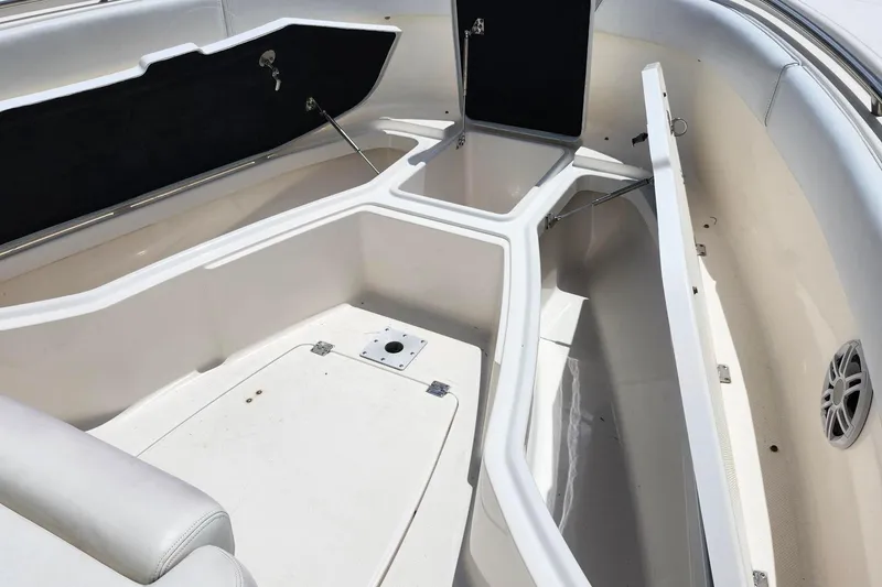 Slide: The Image of 2015 Robalo R300 Center Console boat interior with open storage compartments. - 25
