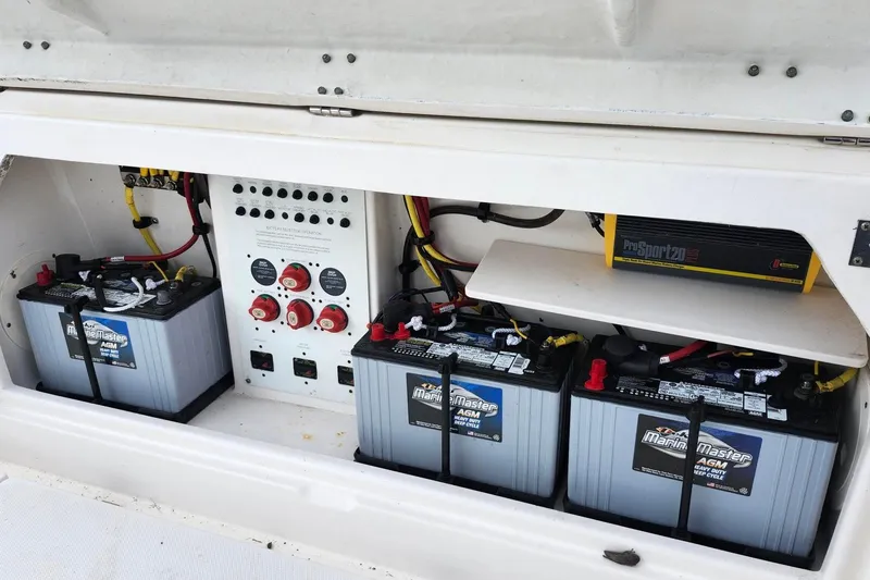 Slide: The Image of 2015 Robalo R300 Center Console boat battery compartment with Marine Master AGM batteries. - 38