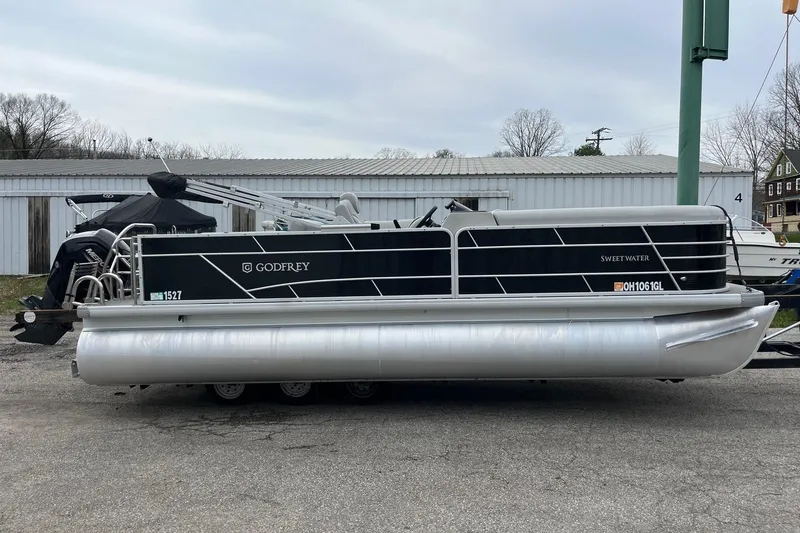The Image of 2023 Godfrey Sweetwater 2286 pontoon boat parked outdoors. - 1