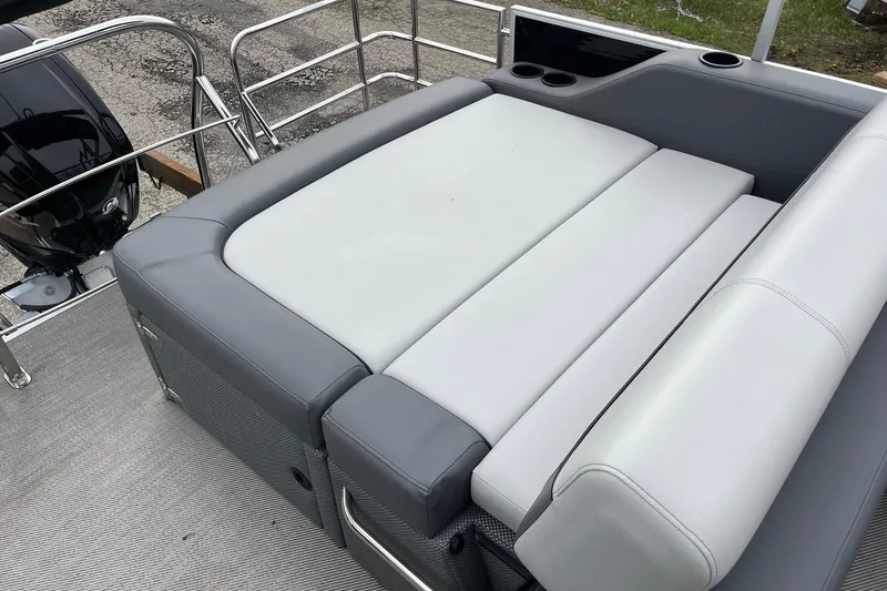 Slide: The Image of 2023 Godfrey Sweetwater 2286 boat with gray and white seating and cup holders. - 11