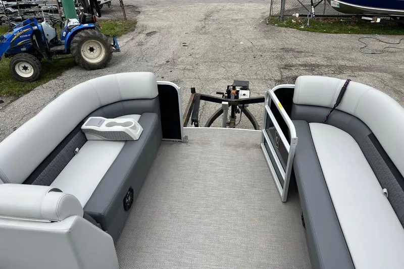 Slide: The Image of 2023 Godfrey Sweetwater 2286 pontoon boat interior with gray seating and cup holders. - 12
