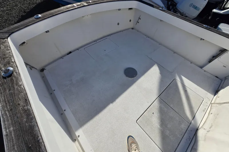 Slide: The Image of 1987 Topaz 29 Sportfisherman boat deck with Yamaha engine visible. - 7