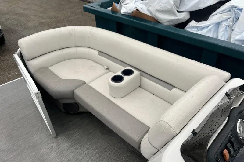 Slide: The Image of 2022 Godfrey Sweetwater 2286 SBX boat interior with cushioned seating and cup holders. - 7
