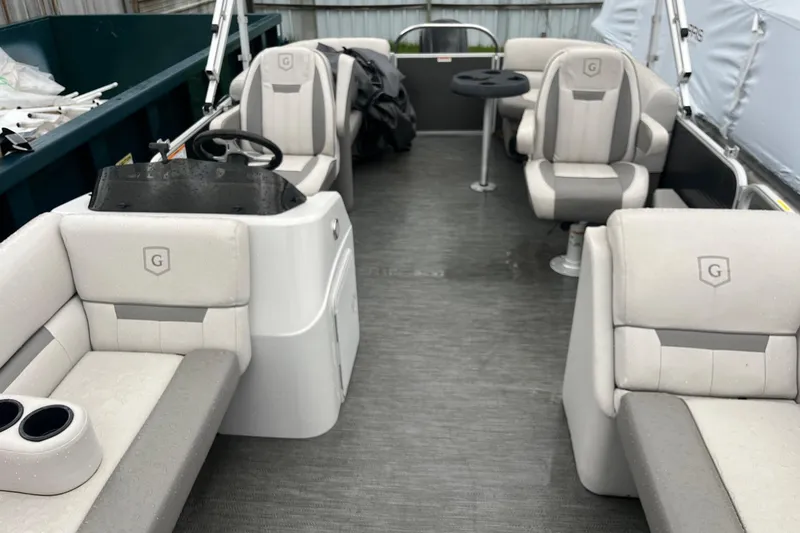 Slide: The Image of 2022 Godfrey Sweetwater 2286 SBX pontoon boat interior with plush seating and steering console. - 9