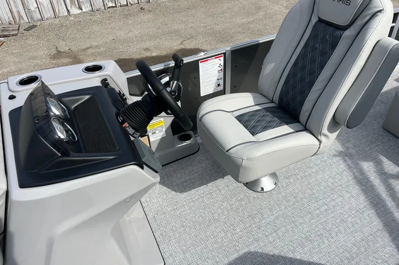 Slide: The Image of Captain's seat and helm of 2026 Harris Cruiser 230 SL boat. - 6
