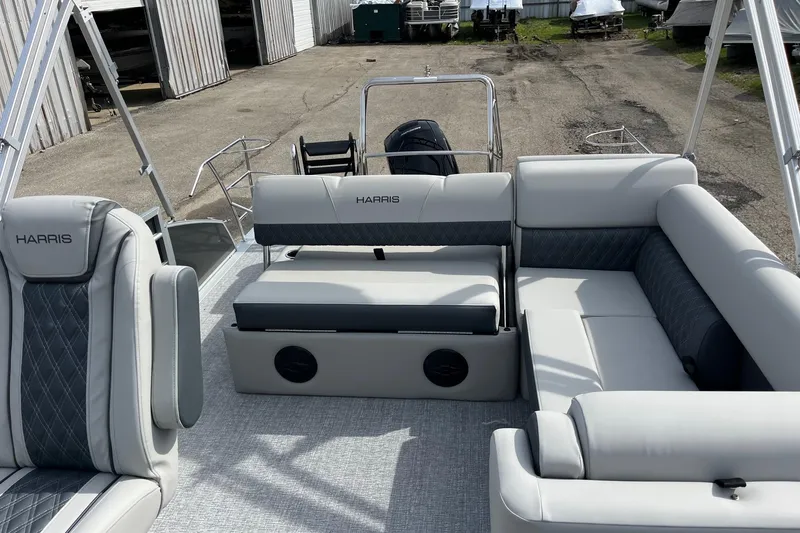 Slide: The Image of 2026 Harris Cruiser 230 SL pontoon boat with luxurious seating and modern design. - 8