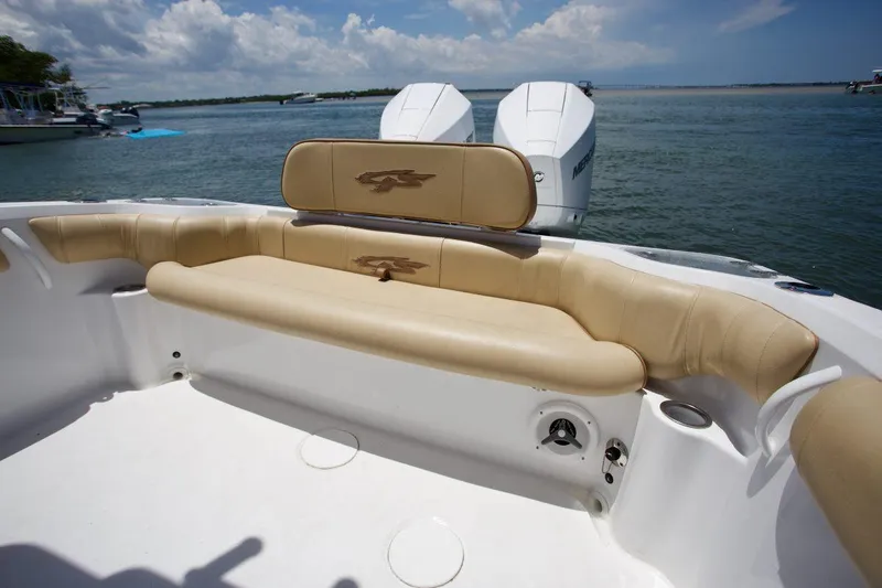 Slide: The Image of 2020 Glasstream 328 Pro-XS boat with sleek black and white design, viewed from below. - 11