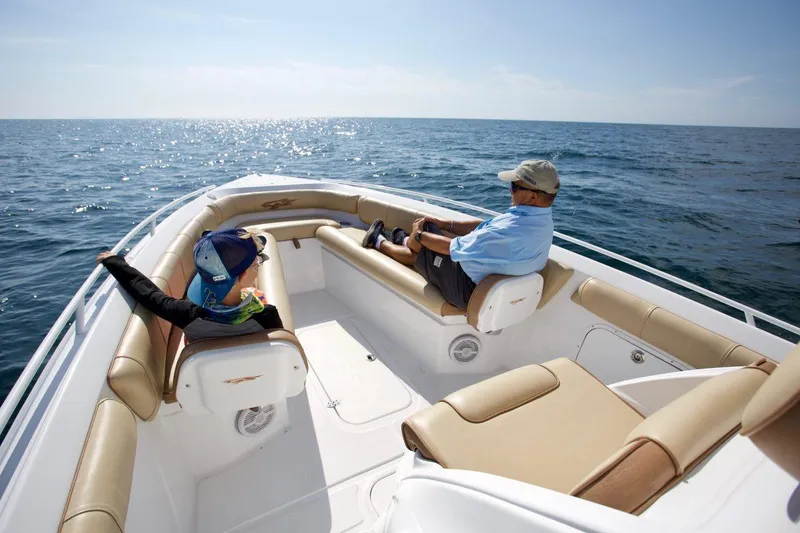 Slide: The Image of 2020 Glasstream 328 Pro-XS boat with triple-axle trailer on gravel lot. - 6