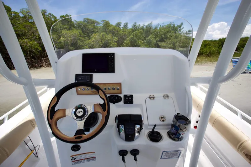Slide: The Image of 2020 Glasstream 328 Pro-XS boat on trailer, parked on gravel, surrounded by trees. - 9