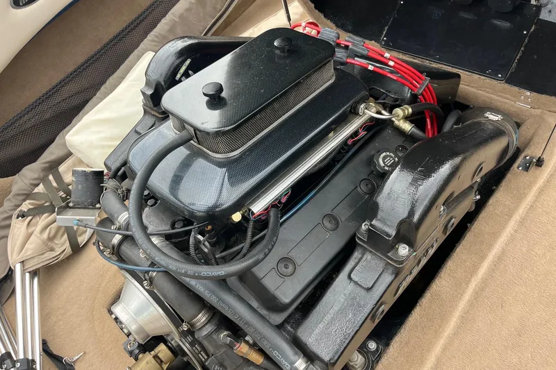 Slide: The Image of Engine of a 2001 Malibu Sunsetter boat, showcasing detailed components and wiring. - 10