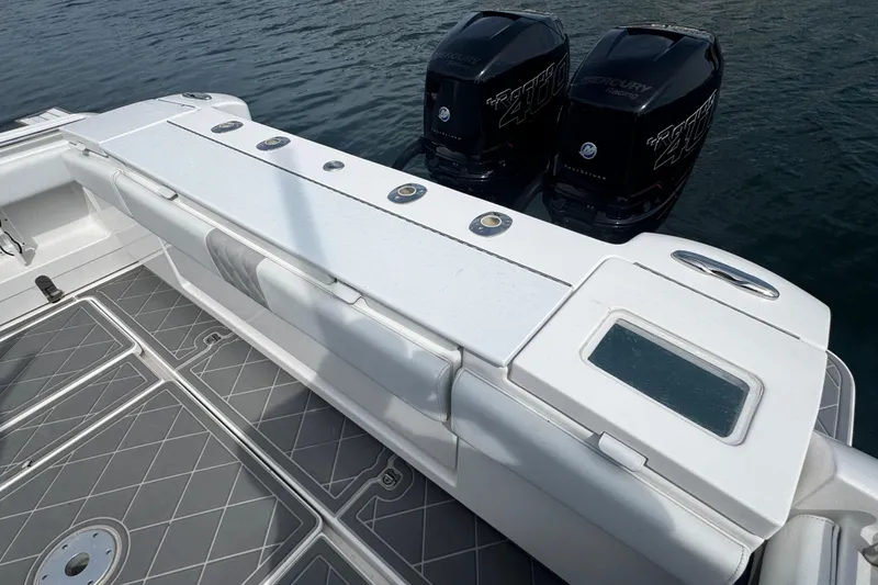 Slide: The Image of 2015 Belzona 32 CC boat with twin Mercury 400 engines on water. - 12