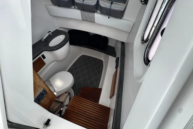 Slide: The Image of 2015 Belzona 32 CC boat interior with modern bathroom amenities and sleek design. - 46