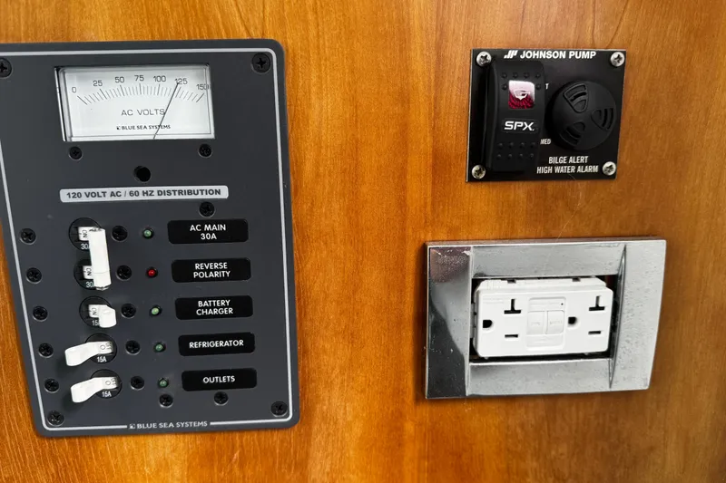Slide: The Image of Electrical panel and bilge alarm on a 2015 Belzona 32 CC boat. - 50