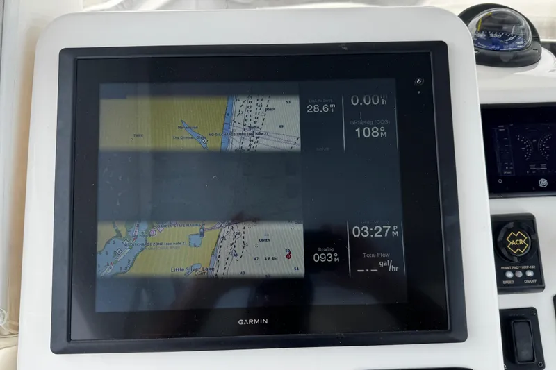 Slide: The Image of Garmin navigation display on 2015 Belzona 32 CC boat, showing map and data. - 55