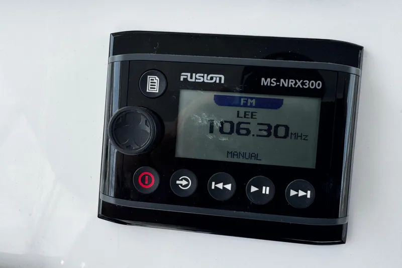 Slide: The Image of Fusion MS-NRX300 radio display on a 2015 Belzona 32 CC boat, tuned to 106.30 MHz. - 59