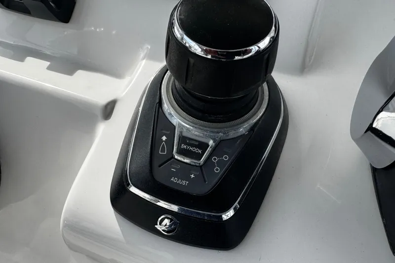 Slide: The Image of Joystick control system on a 2015 Belzona 32 CC boat dashboard. - 63