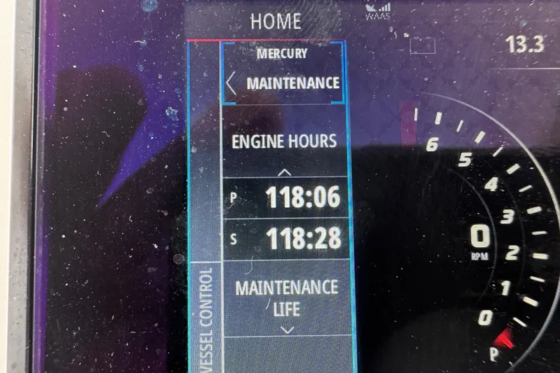 Slide: The Image of Display screen showing engine hours and maintenance for 2015 Belzona 32 CC boat. - 69