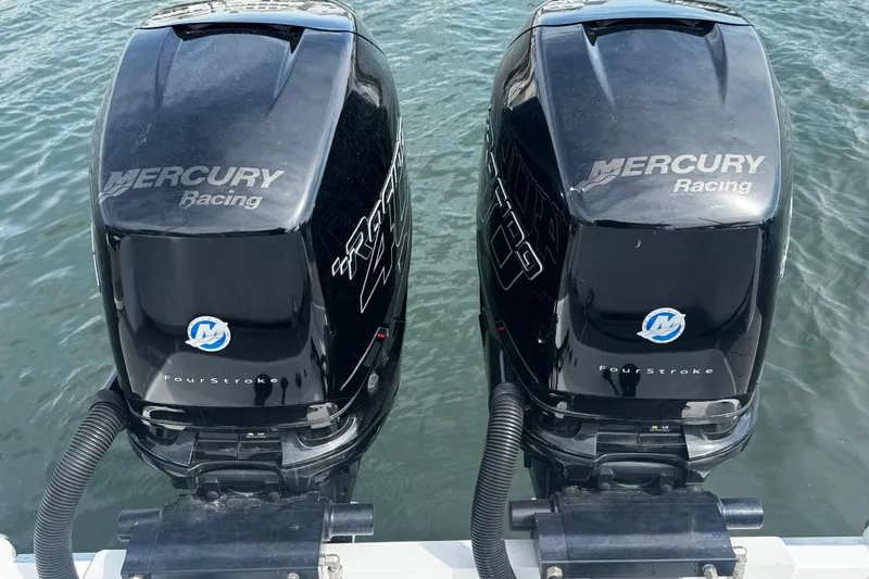 Slide: The Image of Twin Mercury Racing outboard engines on a 2015 Belzona 32 CC boat. - 9