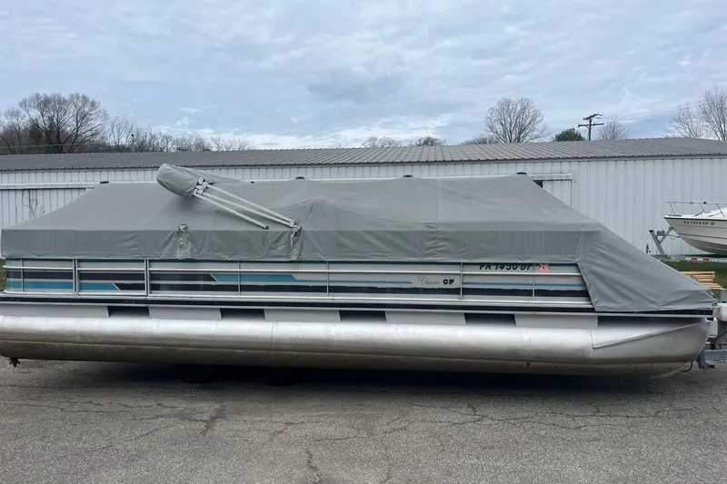 The Image of 1992 Harris FloteBote 240 Classic pontoon boat covered, parked outdoors. - 1
