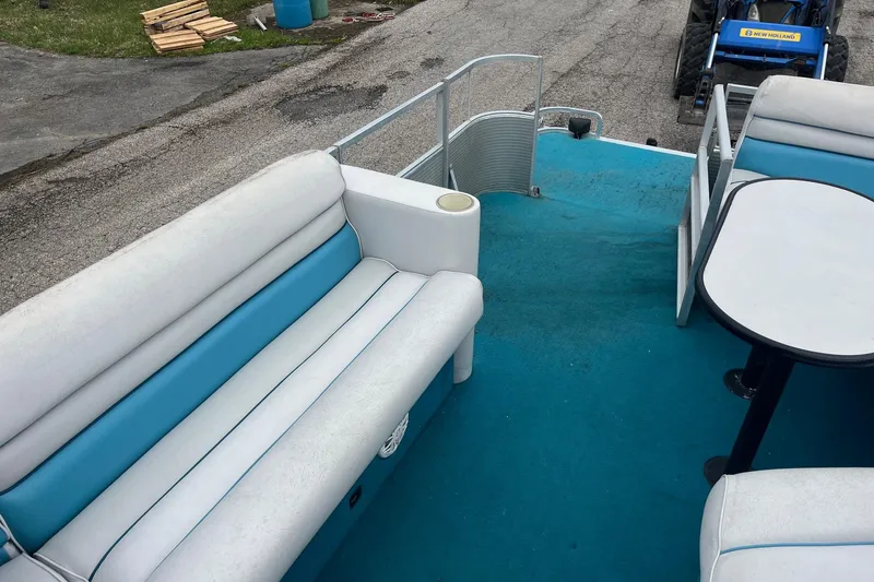 Slide: The Image of 1992 Harris FloteBote 240 Classic pontoon boat interior with blue and white seating. - 10