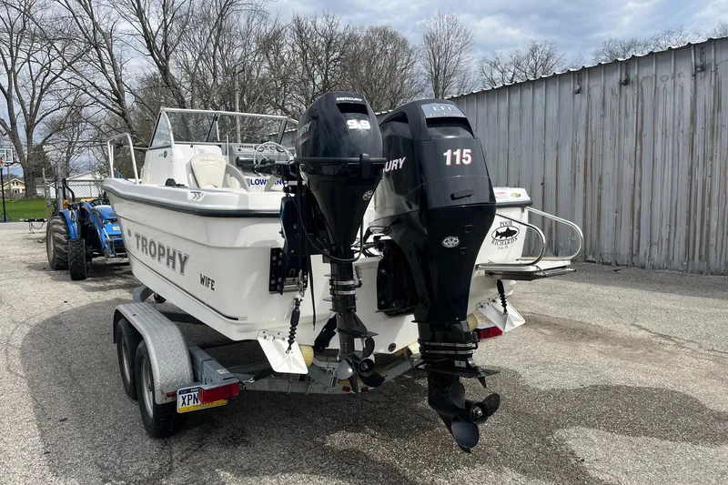 Slide: The Image of 2010 Trophy 1802 Walkaround boat on trailer with dual Mercury outboard engines. - 4